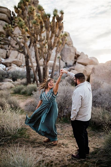 Joshua Tree California Adventure Engagement Session Engaged Couple Kissing At Desert Sunset