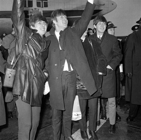 The Beatles Wave To Some Of The Thousands Of Fans Who Turned Out To