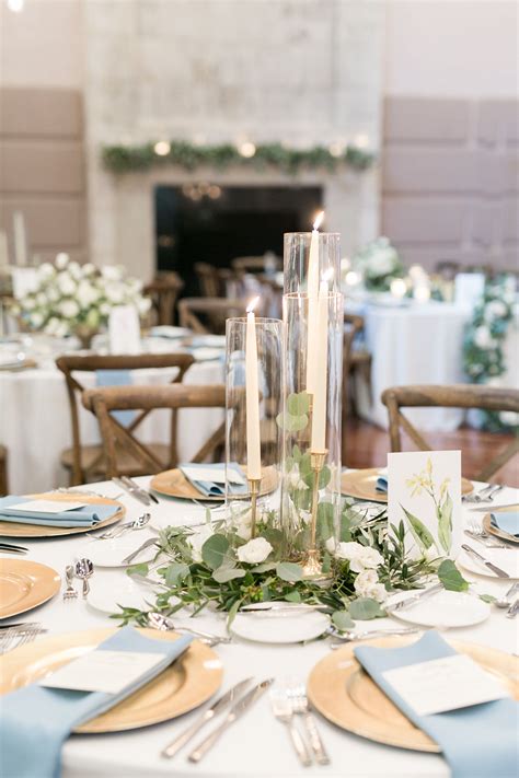 Elegant Simplicity In This Reception Centerpiece Of Eucalyptus And