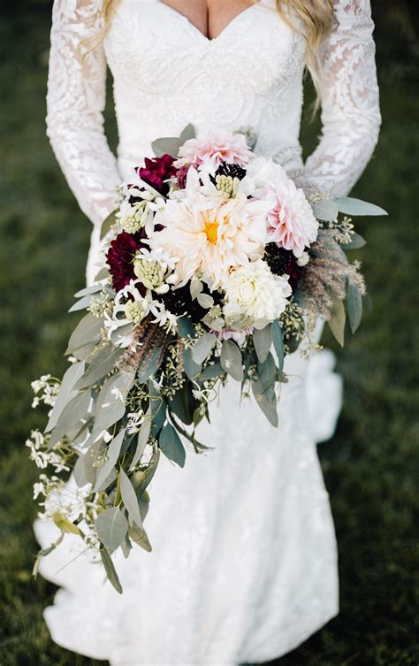 Discover exotic orchids and aromatic rose stems offset by textured foliage. Romantic Cascading Wedding Bouquet by bundles & blooms ...