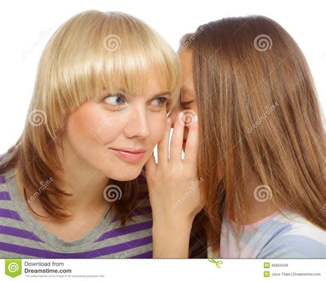 Girl whispering secrets in her mommy s ear