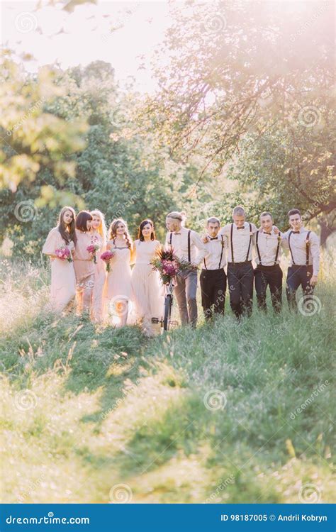 Photo Of The Modern Dressed Best Men Bride Bridesmaids Holding The