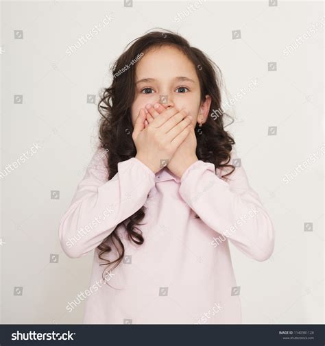Shocked Little Girl Covering Her Mouth Stock Photo Edit Now 1140381128
