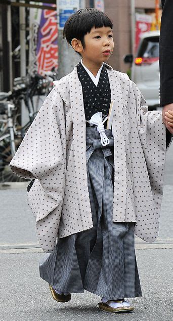 Boy In Traditional Costume Visit The Shinto Shrine As Part Of A Coming