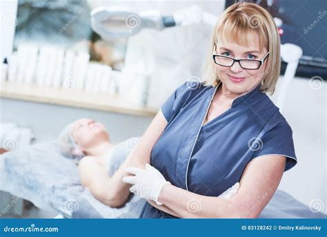 Adult Female Cosmetologist In Cosmetology Cabinet Stock Photo Image