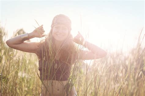 Young Female Hippie In Grass Meadow By Visualspectrum Stocksy United