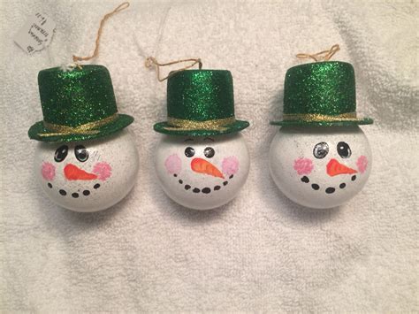My snowmen lightbulb ornaments with top hats | Light bulb ornaments, Christmas ornaments, Ornaments