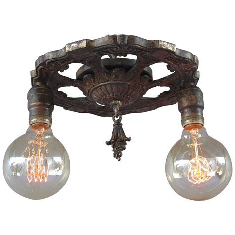Purchase antique ceiling light fixture in bulk amounts to use when building public roads and keeping them separate from nearby sidewalks. Antique 1920s Two-Light Ceiling Mount Light Fixture at 1stdibs