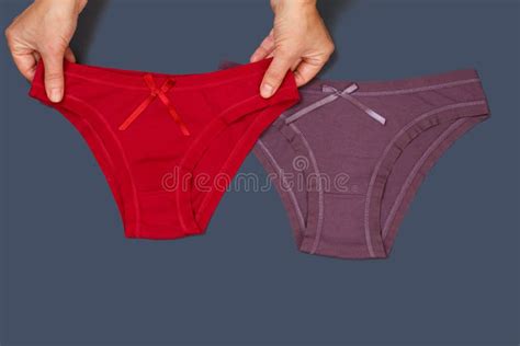 women`s hands with beautiful panties and sanitary pads on beige background stock image image