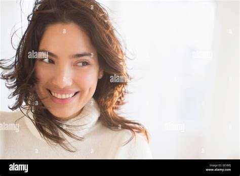 Smiling Young Woman Looking Sideways Stock Photo Alamy