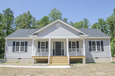 Beautiful Ranch Style Home With Gray Siding And A Front Porch ©balducci