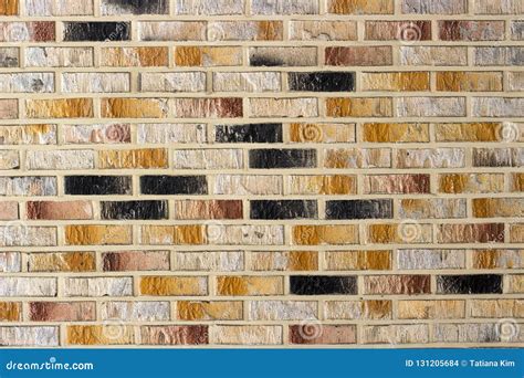 The Multi Colored Brick Wall Close Up Texture And Background Stock