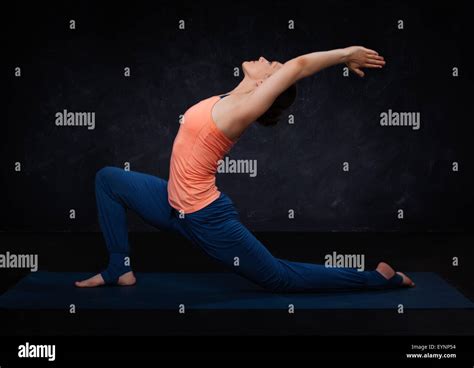 Fit Yogini Woman Practices Yoga Asana Anjaneyasana Stock Photo Alamy