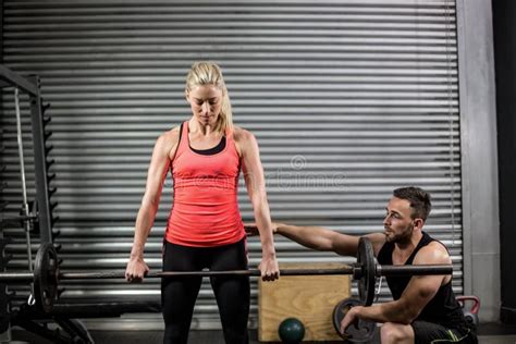 Trainer Helping Woman With Lifting Barbell Stock Image Image Of Assisting Helping 66174927