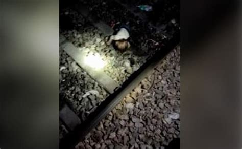 delhi woman daughters run over by train 1 year old son found crying on tracks