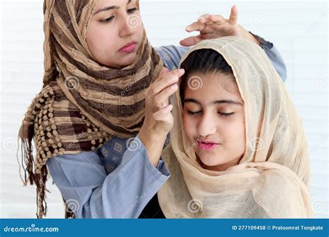 Muslim Mother Dressing Up Her Daughter Girl With Traditional Hijab Scarf Adorable Happy Smiling