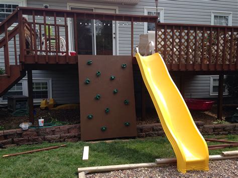 Backyard Deck Project For The Kids Rock Wall And Slide Backyard