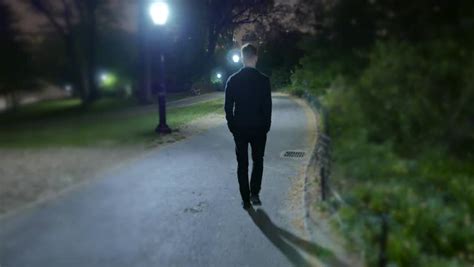 Man Walking Alone Night Park Shadow Stock Footage Video 100 Royalty