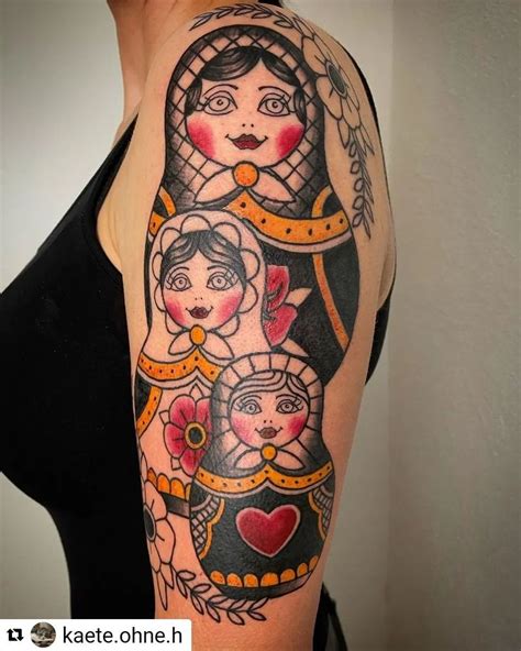 A Womans Arm With An Image Of Two Women And A Cat On It