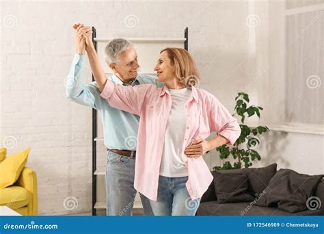 Happy Senior Couple Dancing In Living Room Stock Image Image Of