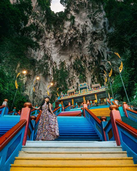 You have to pay an entrance fee (rm15 for foreigners, rm7 for malaysian residents) and cross a crooked bridge over a carp pool. Batu Caves and the Rainbow Stairs