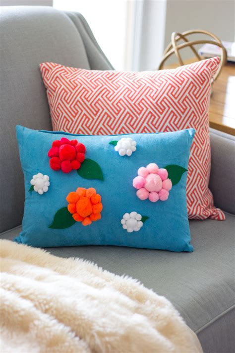 The term may refer to large tufts used by cheerleaders, or a small, tighter ball attached to the top of a hat, also known as a bobble or toorie. Pom Pom Flower Pillow Pictures, Photos, and Images for ...
