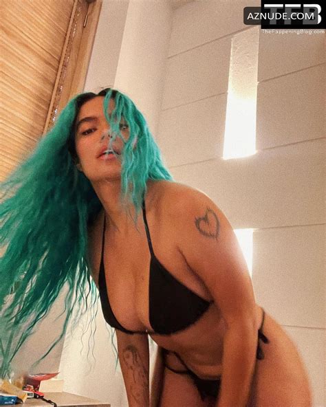 Karol G Sexy Poses Showcasing Her Tits And Butt Wearing A Black Bikini In A Social Media