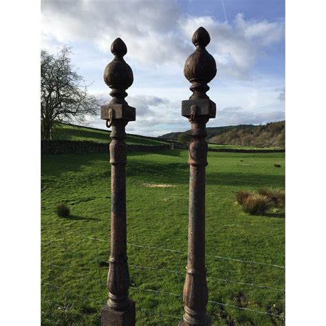 A Pair Of Decorative Cast Iron Posts - YEW TREE BARN