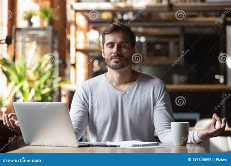 Calm Healthy Businessman Meditate at Desk Feeling Zen No Stress Stock