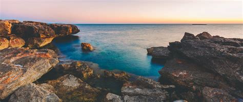 Download Wallpaper 2560x1080 Sea Stones Rocks Coast Landscape Dual