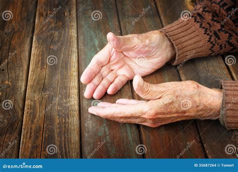 Close Up Of Elderly Hands Holding Each Other Grandfather Hands Is