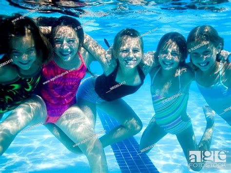 Girls Swimming Underwater In Pool Stock Photo Picture And Royalty