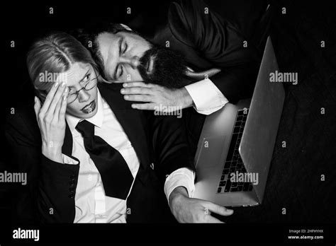 Tired Businessman Sleeping In Dark Office Young Business Woman