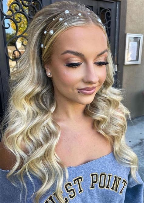 Long Blonde Glam Waves With A Center Part Slicked Behind The Ears And Pearl Accessories On The