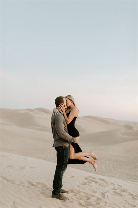 sand dunes engagement session couples casual outfit inspiration posing inspiration desert