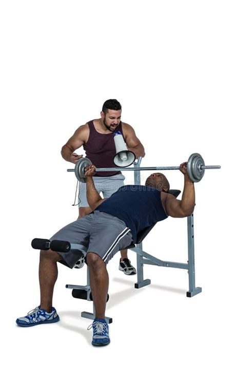 Trainer Helping Muscular Man To Lift Barbell Stock Photos Free