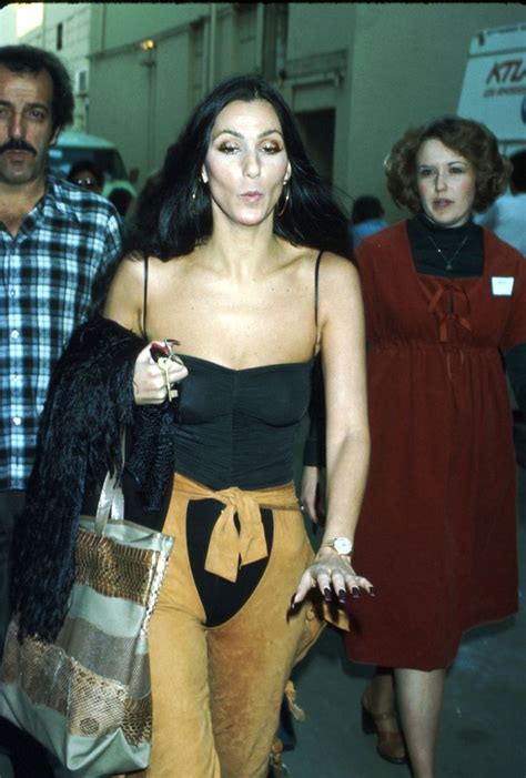 Cher S Most Iconic Fashion Moments Over The Last 6 Decades Cher Outfits Cher Looks 70s