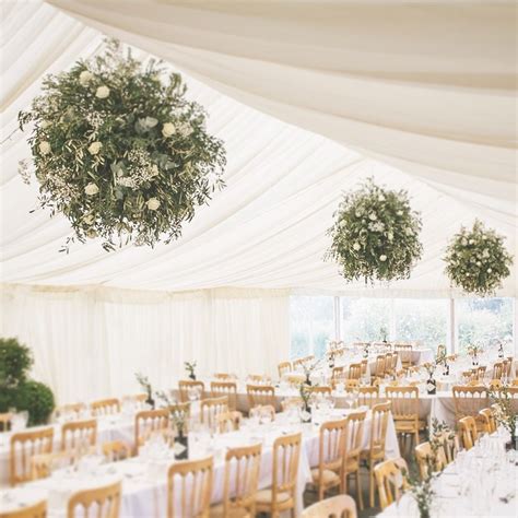 wedding hanging balls wedding marquee installations flower and foliage balls olive and roses