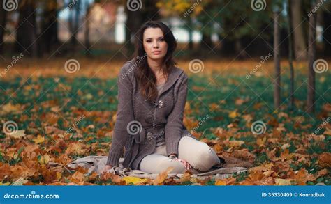 Beautiful Woman Relaxing In Autumn Park Stock Image Image Of Leaves