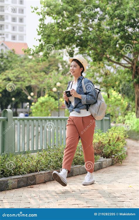 Beautiful Asian Woman Backpacker Holding Camera Travel On Street Young