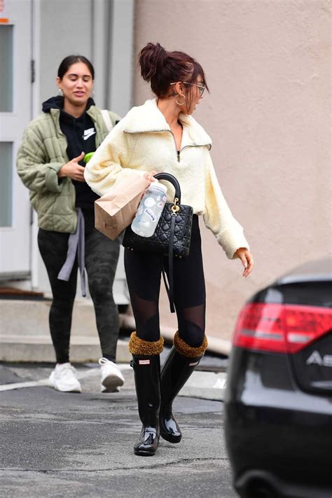 Sarah Hyland In A Black Rubber Boots Was Seen Out In La