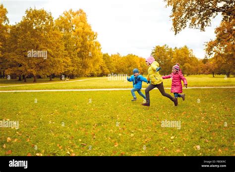 Group Of Happy Little Kids Running Outdoors Stock Photo Alamy