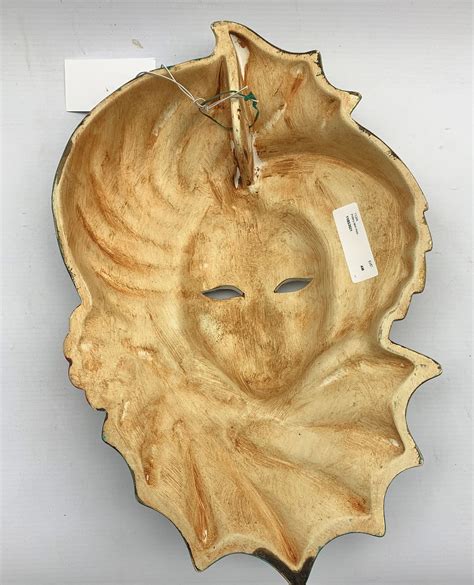 painted-pottery-face-mask-modelled-as-a-lady-wearing-an-elaborate