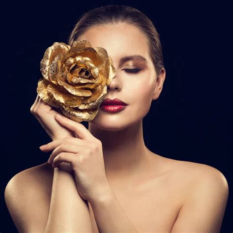 Woman Face With Golden Flower Rose On Face Fashion Model Beauty Makeup Portrait Stock Image