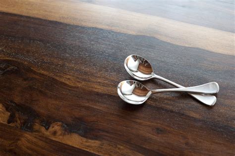 Two Silver Soup Spoons On Wood With Copy Space Free Stock Image