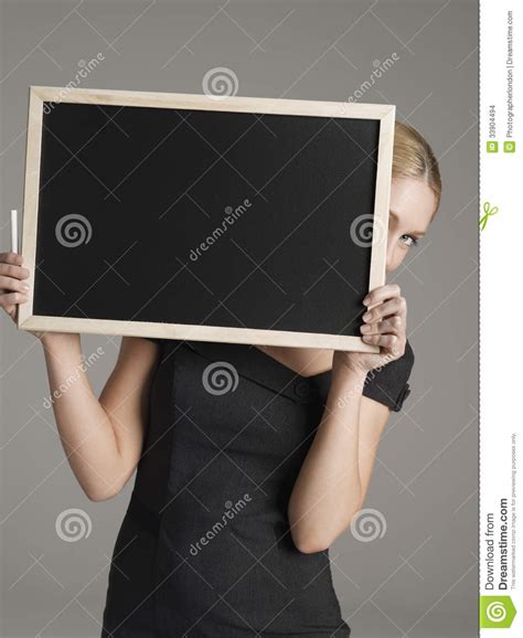Female Teacher Peeking From Behind Blackboard Stock Photo Image Of