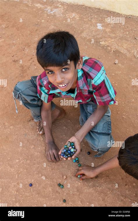 Indian Boys Playing Marbles In A Rural Indian Village Andhra Pradesh