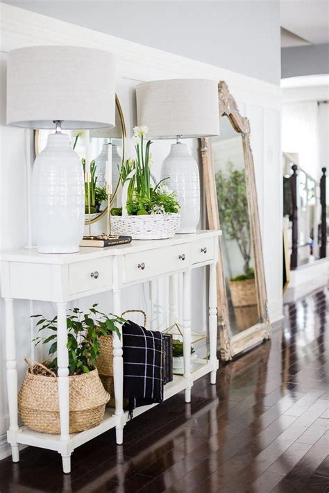 An oversize mirror visually makes the space look and feel larger, and a tall indoor tree makes the space feel more expansive by drawing the eye up. 36 Simple Spring Entryway Ideas On a Budget #ChicModernHomeDecor | Decor, Modern house