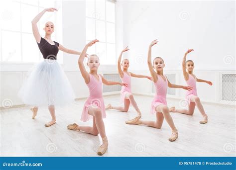 Teacher Helping Her Students During Dance Class Stock Photo Image Of