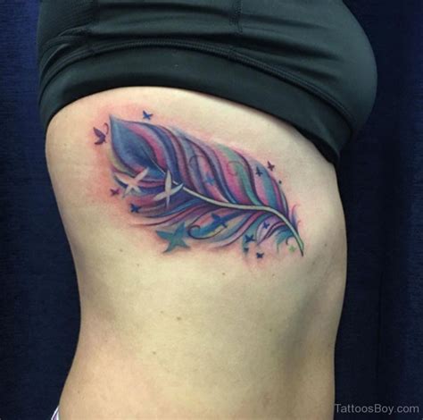 Girly Feather Tattoo On Rib Tattoo Designs Tattoo Pictures